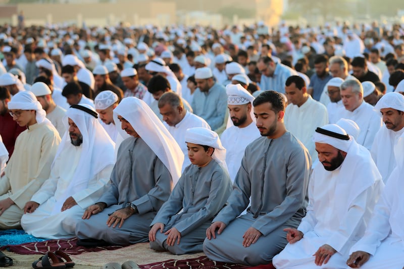 Muslims offer prayers in Al Barsha on Friday. Chris Whiteoak / The National