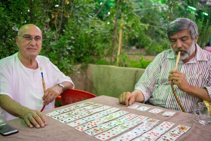 Locals gather for cards, coffee and shisha in Tal Olya, one of the city's oldest cafes after iftar