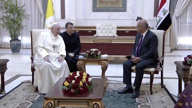 Iraqi President Barham Salih and Pope Francis talk during a meeting at the Presidential Palace. Reuters