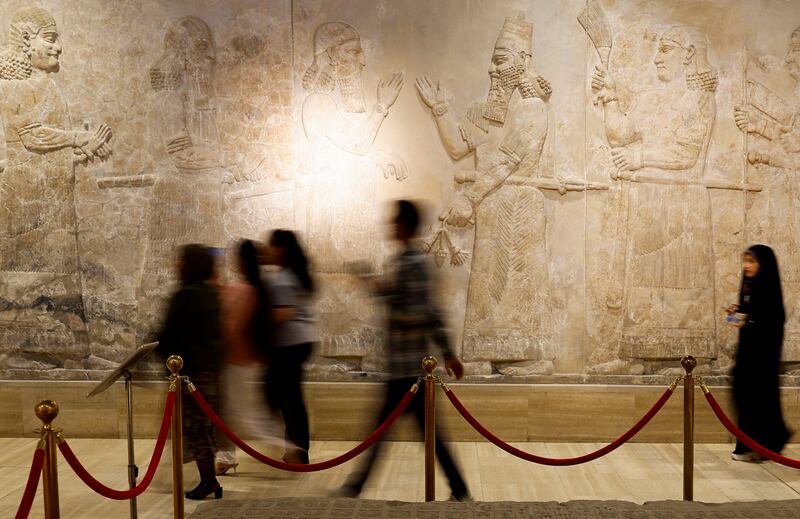 Visitors tour Iraq's National museum in Baghdad. It has reopened to the public after a three-year closure due to the spread of Covid-19 and local unrest. 