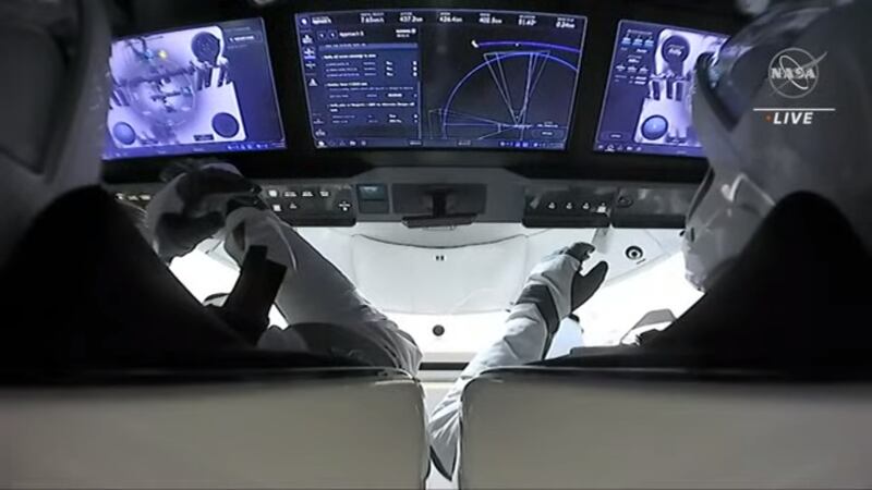 The astronauts watch the docking process on their screens inside the Dragon capsule. Photo: Nasa