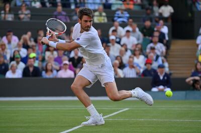 Great Britain's Cameron Norrie plays a backhand against Belgium's David Goffin during their quarter-final match on day nine of Wimbledon in London, England. Getty Images