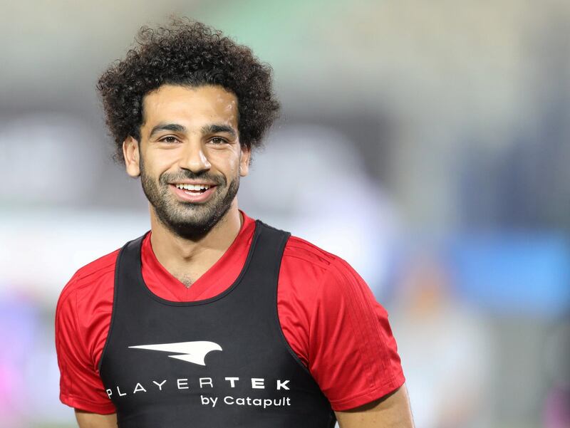 Mohamed Salah smiles during the training session. Mohamed Abd El Ghany / Reuters