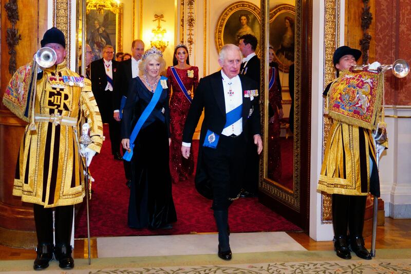 King Charles III and the Queen Consort make a grand entrance. PA