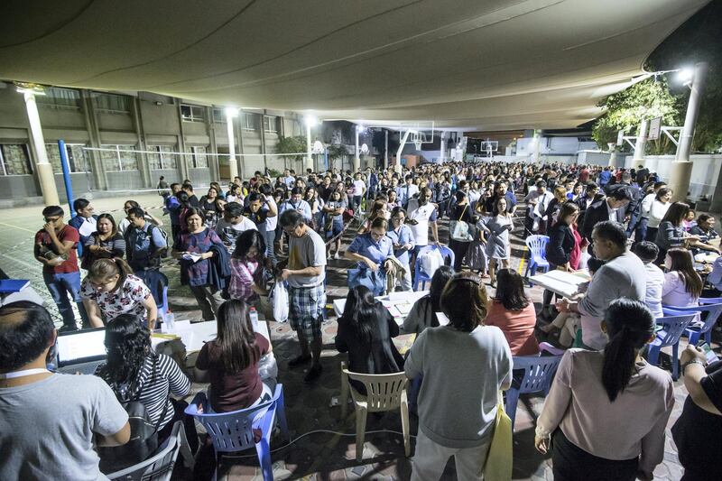 DUBAI, UNITED ARAB EMIRATES -Crowd waiting to get their tickets for the Papal Mass on February 3, 2018 in Abu Dhabi at St. Mary's Catholic Church, Oud Mehta.  Leslie Pableo for The National for Patrick Ryan's story