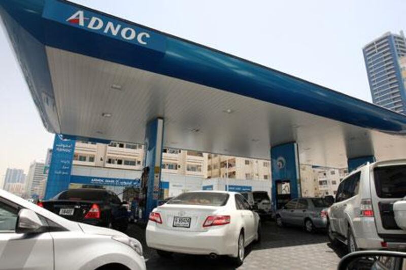 
SHARJAH , UNITED ARAB EMIRATES – May 13 , 2013 : Motorist refueling their cars at the ADNOC gas station near King Faisal road in Sharjah. ( Pawan Singh / The National ) For News. Story by Yasin Kakande

