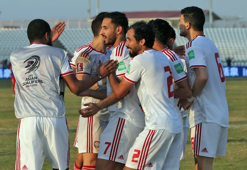 UAE's Ali Mabkhout celebrates with teammates after scoring. AFP
