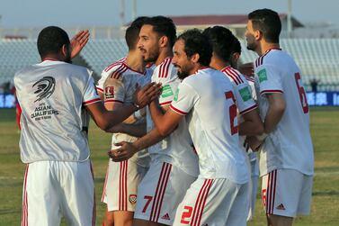 UAE's forward Ali Mabkhout celebrates with his teammates after scoring a goal during the 2022 Qatar World Cup Asian Qualifiers football match between Lebanon and UAE, at the Saida Stadium in the southern Lebanese city of Sidon on November 16, 2021.  (Photo by AFP)