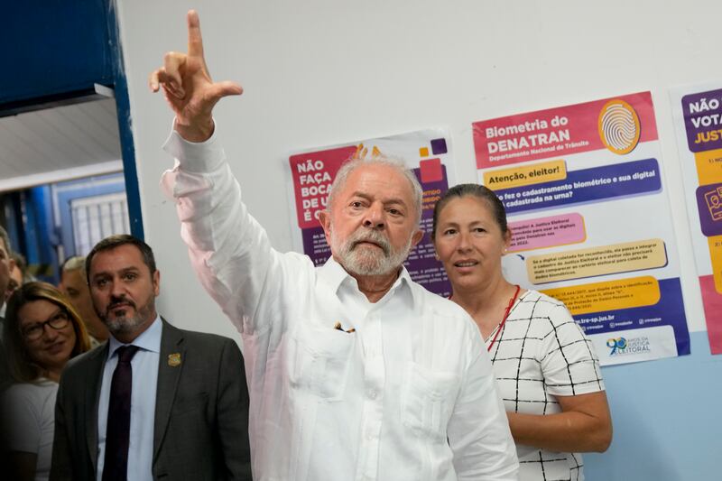 Mr da Silva waves after voting. AP