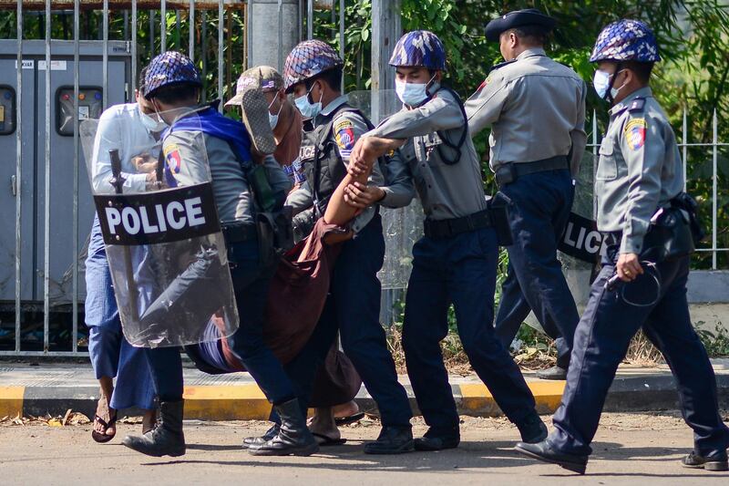 Police arrest a protester during a demonstration against the military coup in Mawlamyine. AFP