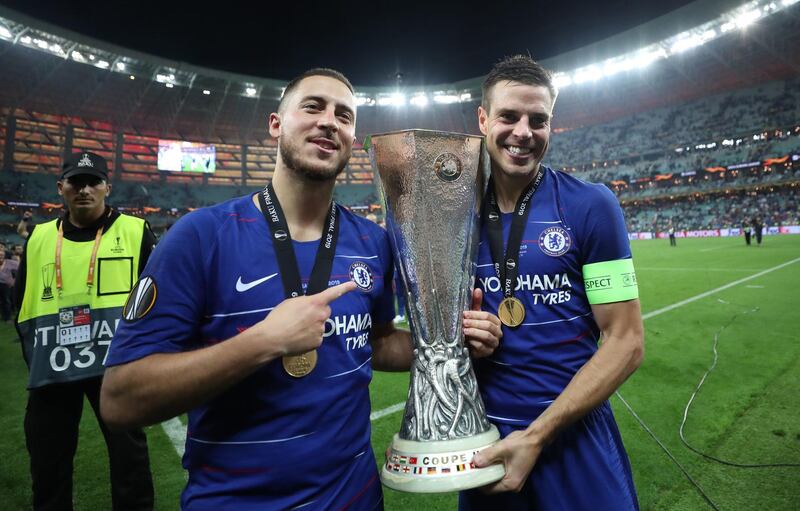 Hazard (left) and Cesar Azpilicueta celebrate with the trophy. PA Photo