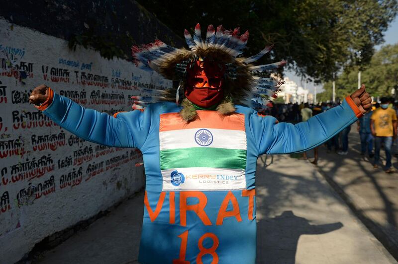 A fan of Indian cricket team with tri-colours painted on his face cheers before the second Test between India and England outside the M.A. Chidambaram Cricket Stadium in Chennai. AFP