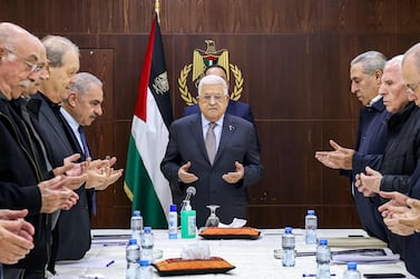 This handout picture provided by the Palestinian Authority's press office (PPO) shows Palestinian president Mahmud Abbas (C) and members of the executive committee of the Palestine Liberation Organisation (PLO) reciting a prayer before their meeting in the city of Ramallah in the occupied West Bank on December 25, 2023.  (Photo by Thaer GHANAIM  /  PPO  /  AFP)  /  === RESTRICTED TO EDITORIAL USE - MANDATORY CREDIT "AFP PHOTO  /  HO  /  PPO " - NO MARKETING NO ADVERTISING CAMPAIGNS - DISTRIBUTED AS A SERVICE TO CLIENTS ===