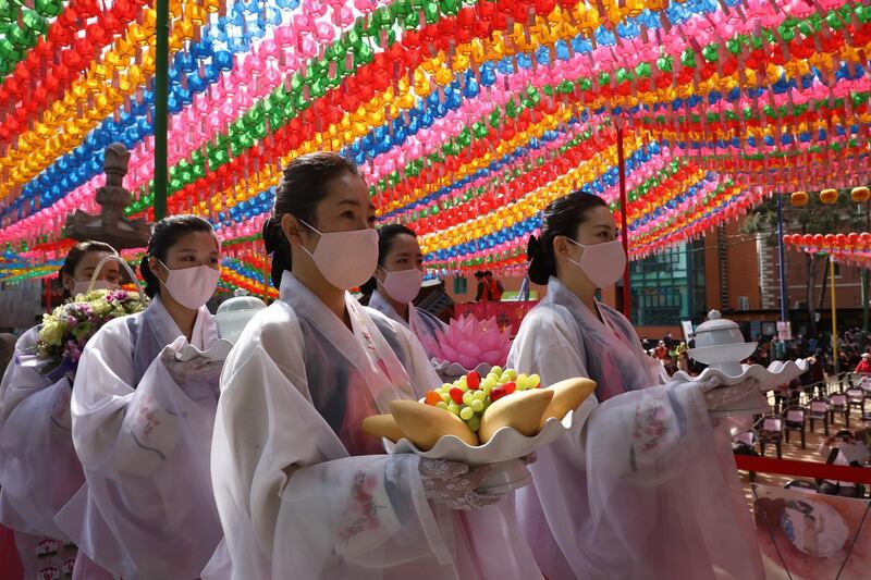 Buddhist believers wear masks as a preventive measure against the coronavirus (COVID-19), as they gather during a birthday of Buddha and service to pray for overcoming the coronavirus (COVID-19) pandemic at Jogyesa Temple in Seoul, South Korea. Buddha was born approximately 2,564 years ago, and although the exact date is unknown. South Korea reported yet another single-digit increase in the number of coronavirus infections, but the country is keeping a watchful eye on this week's holidays, which could lead to more cases. According to the Korea Center for Disease Control and Prevention, 4 new cases were reported. The total number of infections in the nation tallies at 10,765. Getty