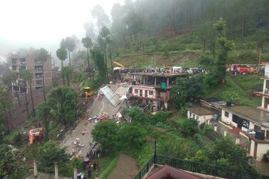 Indian rescuers work on a site after a multistorey building collapsed following heavy rains near Kumarhatti, in Himachal Pradesh’s Solan district. AFP