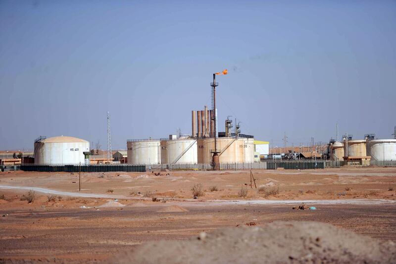 (FILES) A file photo taken on January 18, 2013 shows a general view of an oil installation on the outskirts of In Amenas, deep in the Sahara near Algeria's border with Libya. A draft law on Algeria's oil and gas sector has been met with hostility by an anti-regime protest movement that fears "the nation's wealth" is being sold off to multinational companies. For nearly nine months Algeria -- Africa's third-largest oil producer and a top 10 global gas producer -- has been swept by an unprecedented popular movement challenging a regime in place since independence from France in 1962.
 / AFP / Farouk Batiche
