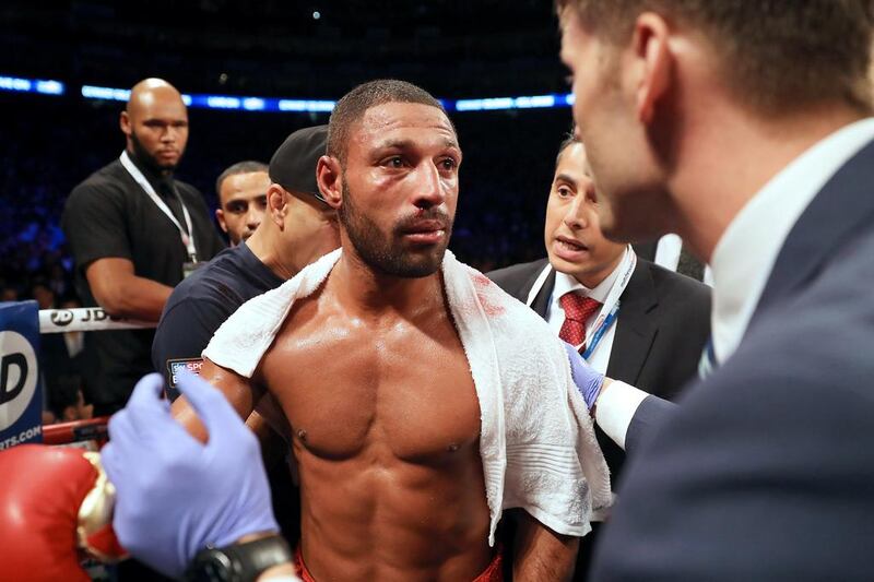 Kell Brook looks on in defeat to Gennady Golovkin after his corner threw in the towel in the fifth round. The British boxer had suffered a series of heavy blows from his opponent. Richard Heathcote / Getty Images