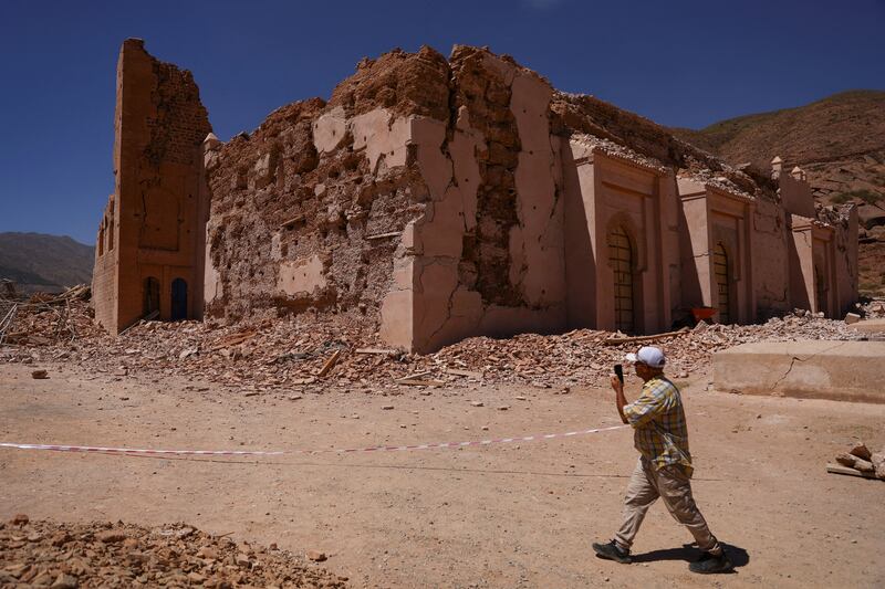 A man walks near Tinmel Mosque, which was damaged by the deadly earthquake, in Tinmel, Morocco. Reuters