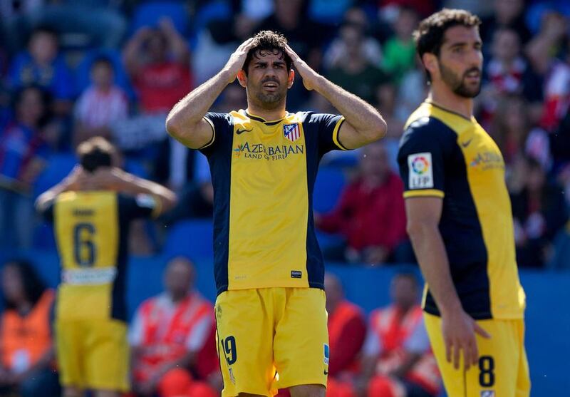 Diego Costa, centre, and his Atletico Madrid cannot believe the opportunity lost to draw the Primera Liga title closer in losing 2-0 to host Levante at Ciutat de Valencia Stadium on May 4, 2014 in Valencia, Spain.  Gonzalo Arroyo Moreno / Getty Images