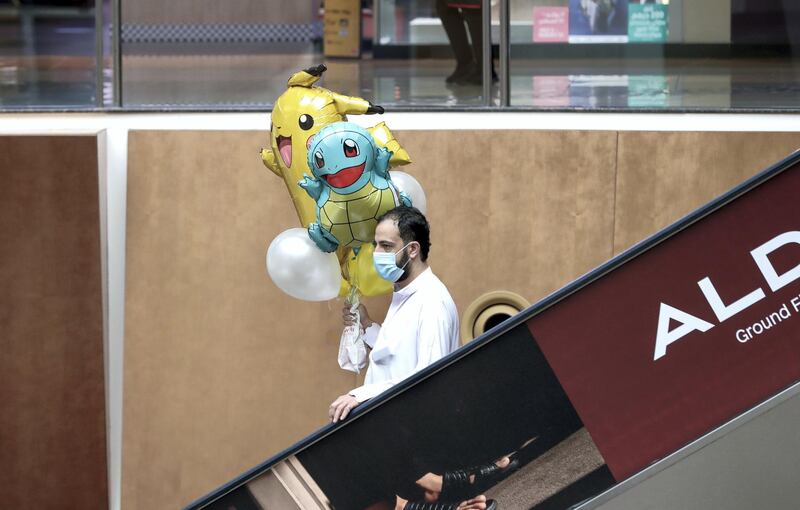 Abu Dhabi, United Arab Emirates, August 2, 2020.   
A man with his newly purchased balloons at Al Wahda Mall on the last day of Eid Al Adha. 
Victor Besa /The National
Section: NA
For:  Standalone/Stock Images