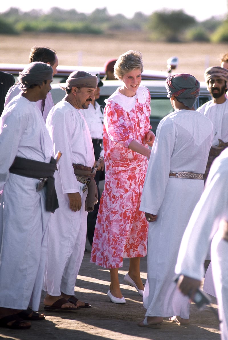 The Princess of Wales arriving for a polo match in Muscat, Oman, in November 1986. She is wearing a dress by Paul Costello. 