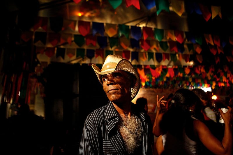A man stands in a dancehall during São João festival in Salvador, Brazil. The festival celebrates the harvest with country-themed costumes, food and music. Courtesy Xposure