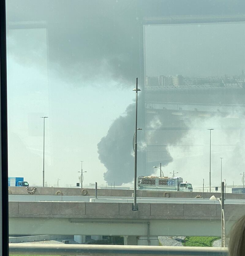 Smoke over the Jebel Ali Freezone Extension area, seen from the Dubai Metro.