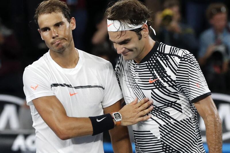 Rafael Nadal and Roger Federer greet each other at the net after the Australian Open final. Dita Alangkara / AP Photo