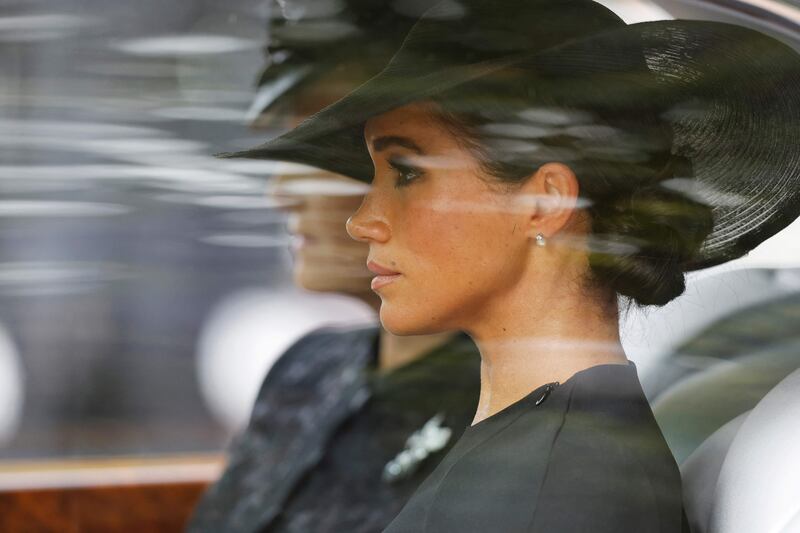 The Duchess of Sussex wears pearl and diamond earrings, which were a gift from the queen. AFP 