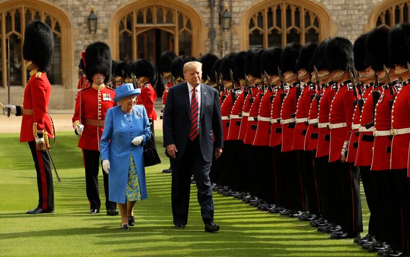 Former US president Donald Trump and the queen inspect a Guard of Honour, formed of the Coldstream Guards, at Windsor Castle in July 2018. Getty Images