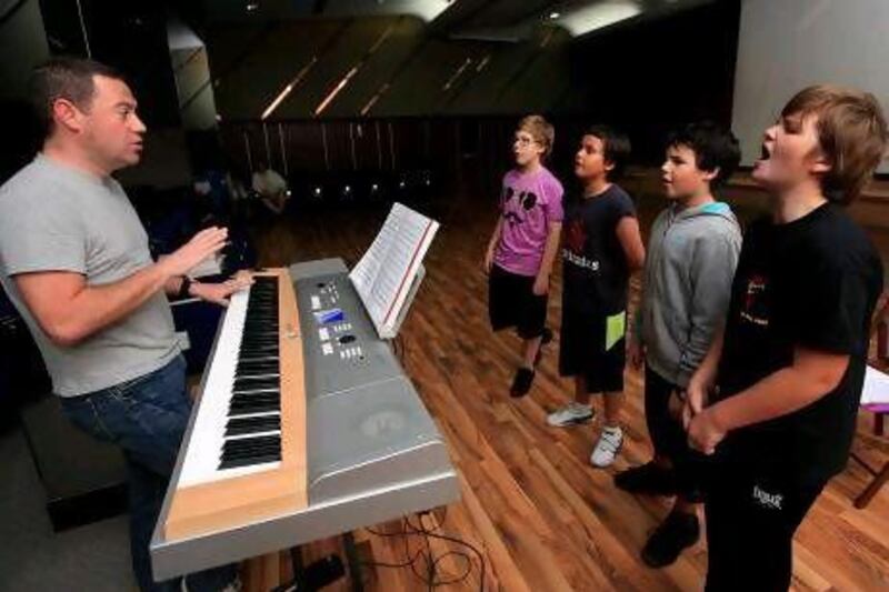 Cast members of London's West End theatre company Popular Productions rehearse the musical Oliver! in Dubai.