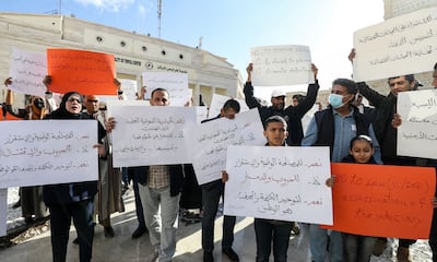 Local NGO activists gather for a demonstration at Algeria Square outside the Tripoli Municipality in the Libyan capital on December 15, 2021, to protest against any possible postponement of the elections scheduled for December 24. AFP