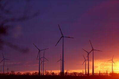Wind turbines at a wind farm during sunset in Nauen Brandenburg, Germany, on Wednesday, Dec. 30, 2020. It was a pivotal year in the transition toward renewable energy, underpinned by massive government spending pledges and corporations working to burnish their environmental, social and governance credentials.