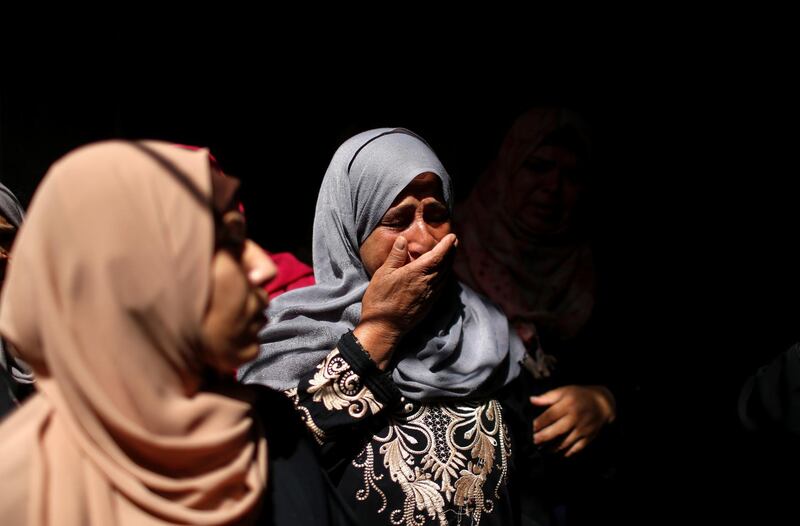 A relative of Palestinian man Ahmed Al Shenbari mourns during his funeral in northern Gaza. Reuters