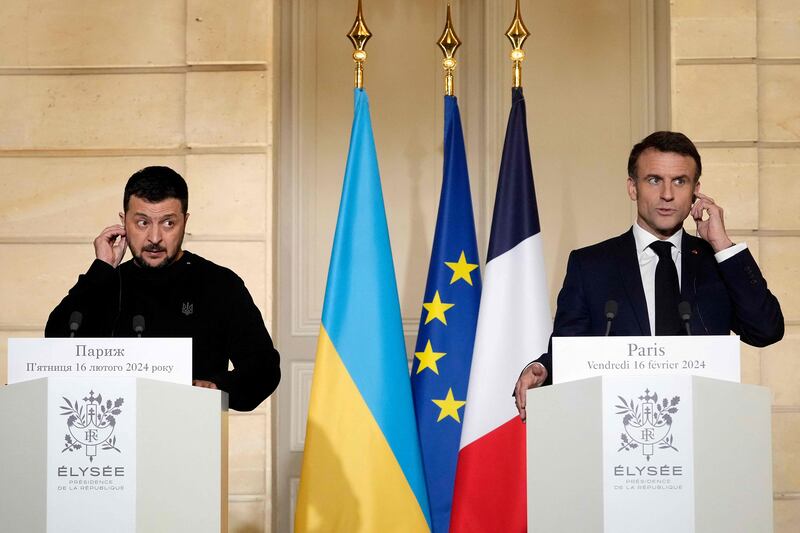 French President Emmanuel Macron, right, and Ukrainian President Volodymyr Zelenskyy address media at Elysee Palace in Paris earlier this month. AFP