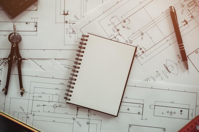 Architecture, engineering plans and drawing equipment for a new building. Getty Images