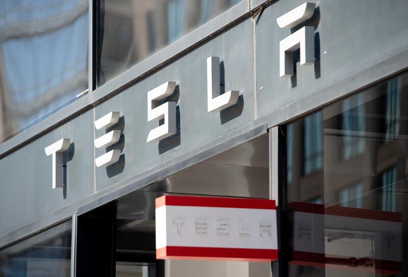 (FILES) In this file photo taken on August 8, 2018 The Tesla logo is seen outside of their showroom in Washington, DC. Tesla's market value soared to more than $500 billion Tuesday ahead of its listing on the S&P 500, with its stock finishing up 6.4 percent or by nearly $32 billion in 24 hours. / AFP / SAUL LOEB
