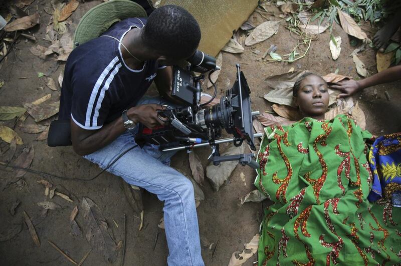 A cameraman films a scene for the movie ‘October 1’, a police thriller directed by Kunle Afolayan, in Ilaramokin village in southwest Nigeria.