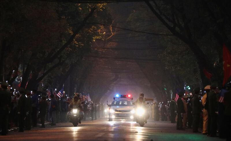 Bystanders line the road as the motorcade of Donald Trump approaches. Reuters