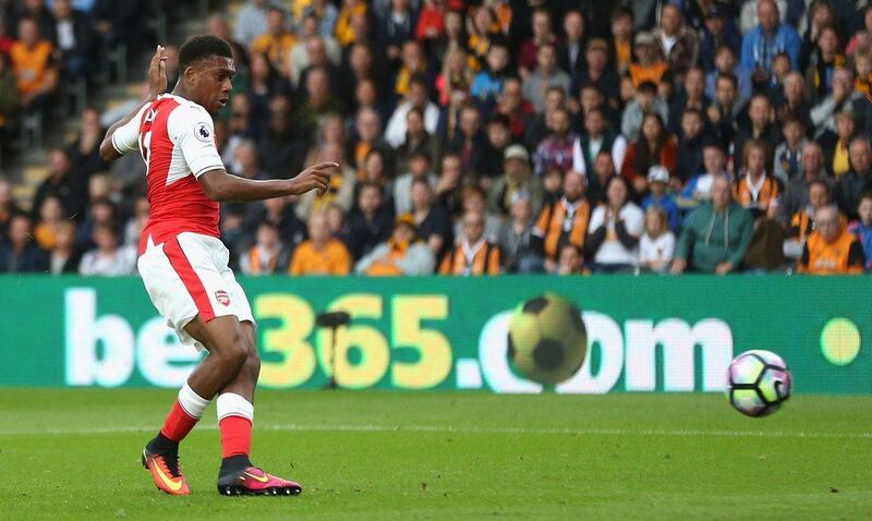 Alex Iwobi of Arsenal hits a shot which leads to the first goal by Alexis Sanchez. Alex Morton / Getty Images