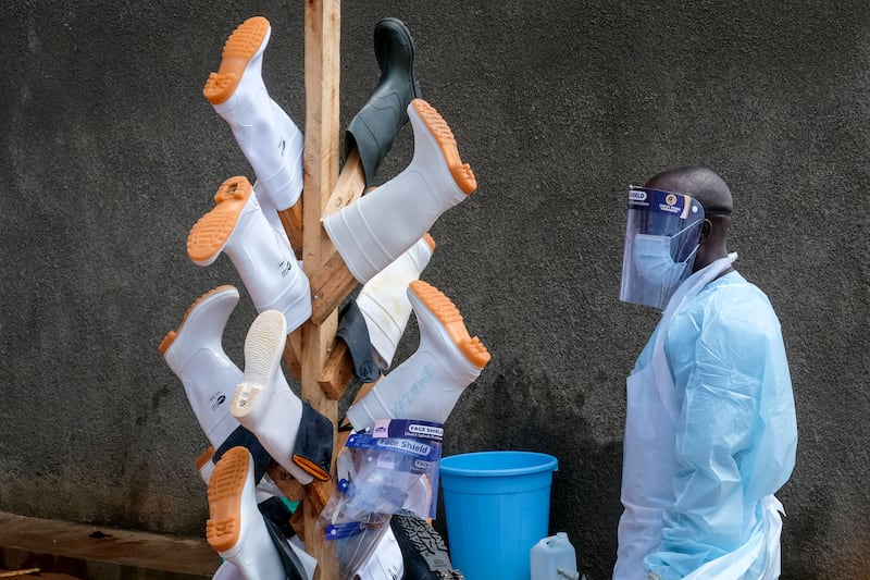 Boots hung up to dry after being disinfected outside the Ebola isolation section of Mubende Regional Referral Hospital. AP