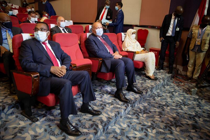 Ethiopia's Foreign Minister Demeke Mekonnen, Egypt's Foreign Minister Sameh Shoukry, and Sudan's Foreign Minister Asma Mohamed Abdalla sit in a theatre in the Fleuve Congo Hotel in Kinshasa in the Democratic Republic of Congo, April 4, 2021. Reuters/Hereward Holland NO RESALES. NO ARCHIVES