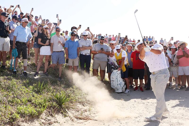 Bryson DeChambeau of the United States plays his second shot on the 11th hole during his first round 72. AFP