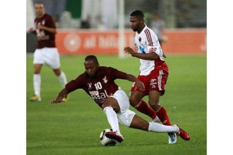 Subait Khater, right, and Al Jazira have laid low the rest of the league. After beating Al Wahda 4-0 Monday night to win the President's Cup, first-place Jazira need the Pro League title to take the double.