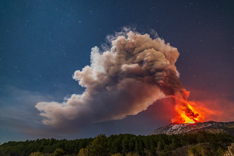 Smoke billows from Mount Etna as lava cascades down the volcano's slope, on the island of Sicily, off Italy's south coast. AP Photo