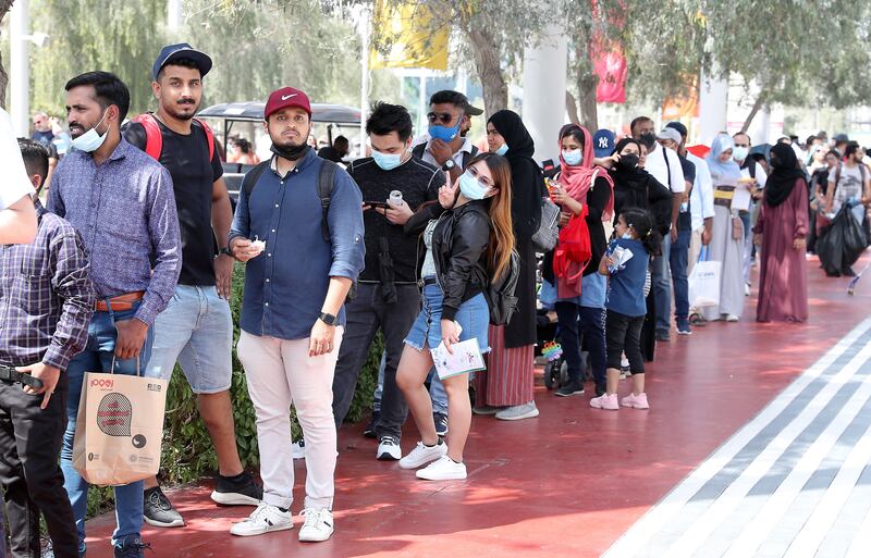 Visitors stand in a queue outside the Germany pavilion at Expo 2020 Dubai.