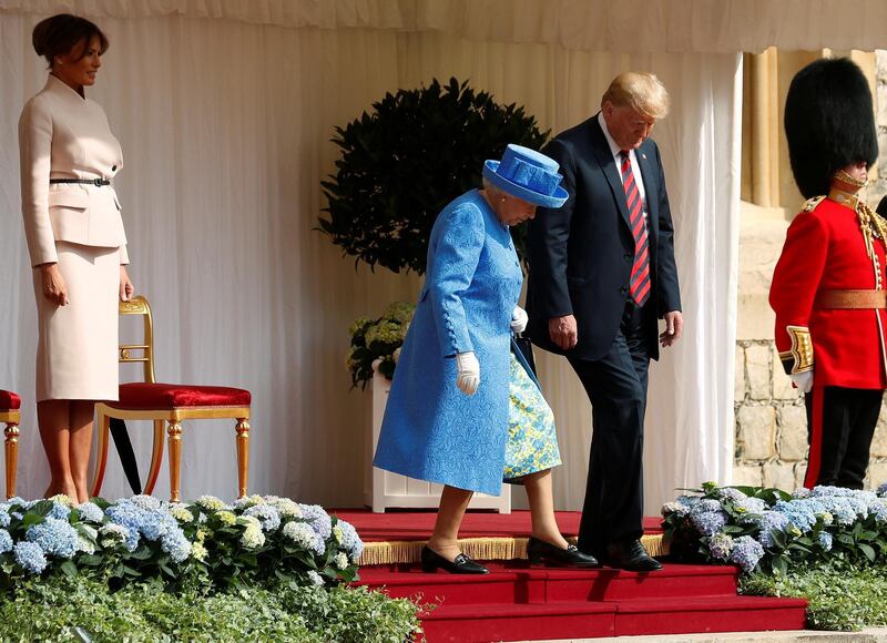 FILE PHOTO: The First Lady Melania Trump waits as U.S. President Donald Trump and Britain's Queen Elizabeth walk across the courtyard to inspect the Coldstream Guards during a visit to Windsor Castle in Windsor, Britain, July 13, 2018. REUTERS/Kevin Lamarque/File Photo