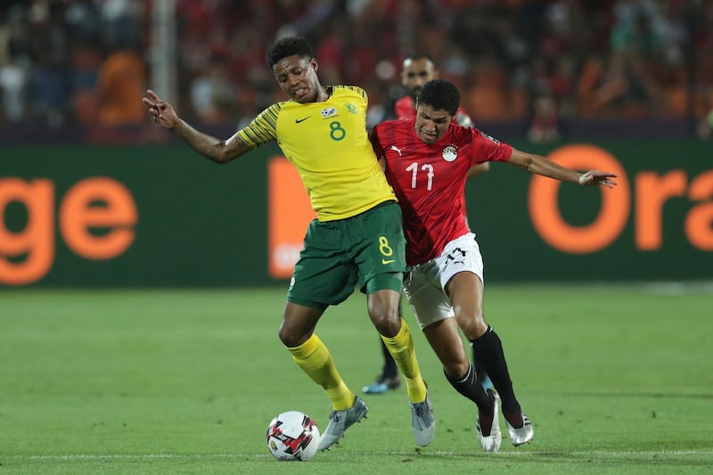 South Africa's Bongani Zungu, left, tussles for the ball with Egypt's Mohamed Elneny. AP Photo