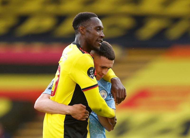 Manchester City's Phil Foden and Watford's Danny Welbeck after the match. Reuters