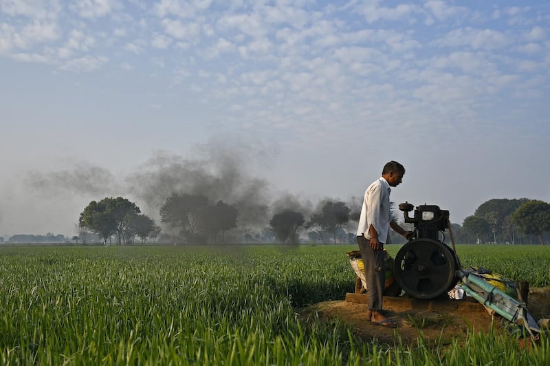 A man turns on a water pump at a farm in Palwal district, Haryana, India, on Friday, Jan. 12, 2018. Time is running out for India's Prime Minister Narendra Modi to shore up the support of rural voters who underpinned his rise to power in 2014, when he won India's biggest mandate in three decades. The budget on Feb. 1 will be the last opportunity for him to announce significant fiscal measures that could win back villagers. Photographer: Anindito Mukherjee/Bloomberg